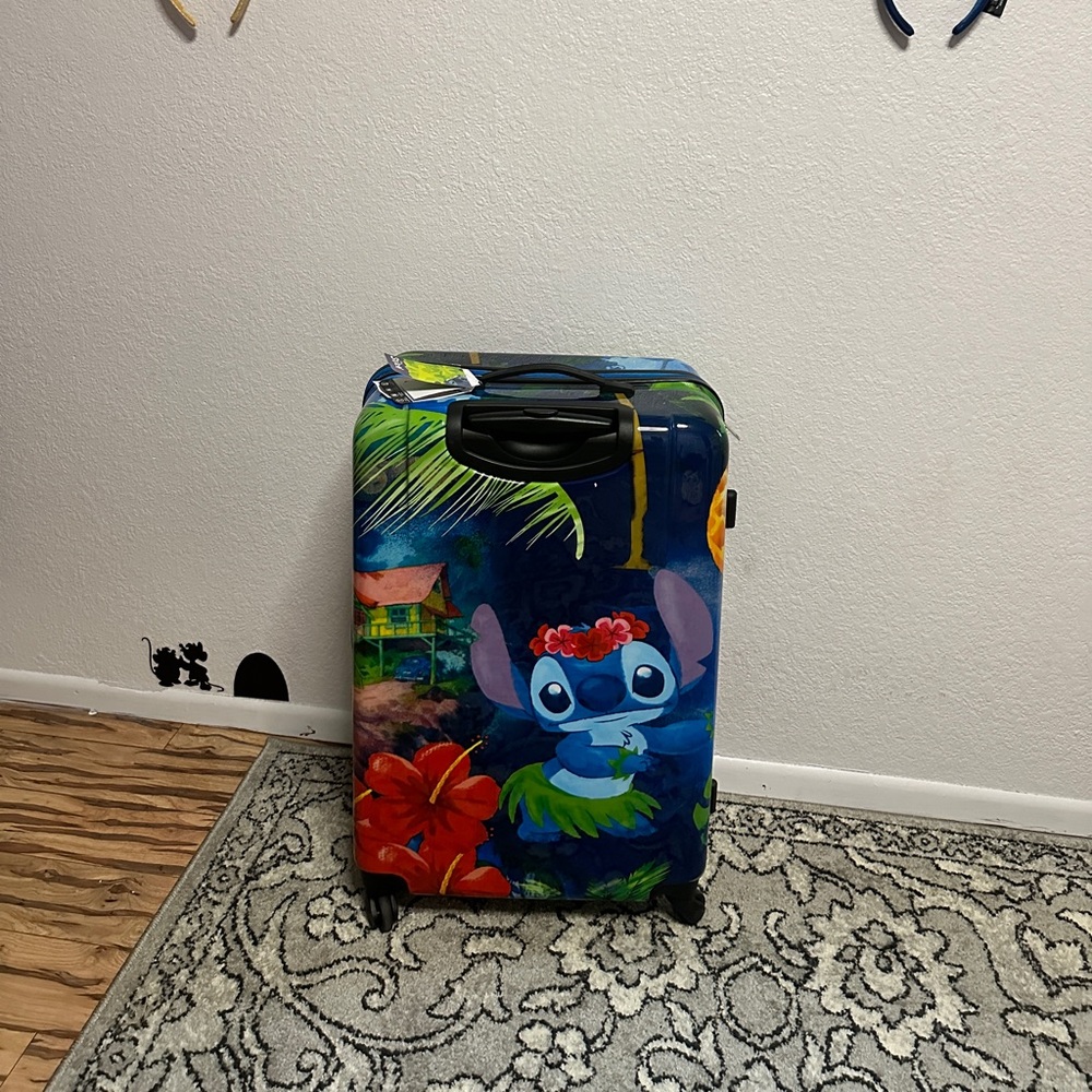 Disney Stitch 28 inch rolling suitcase brand new.